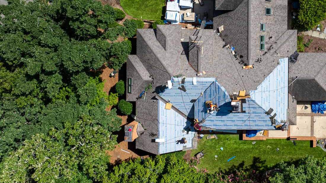 Drone view of the Gonzalez crew installing underlayment on a Triangle, NC roof